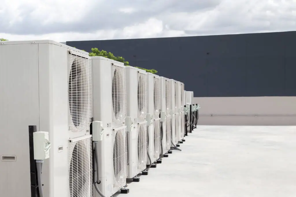 Commercial HVAC 3 a row of white air conditioners
