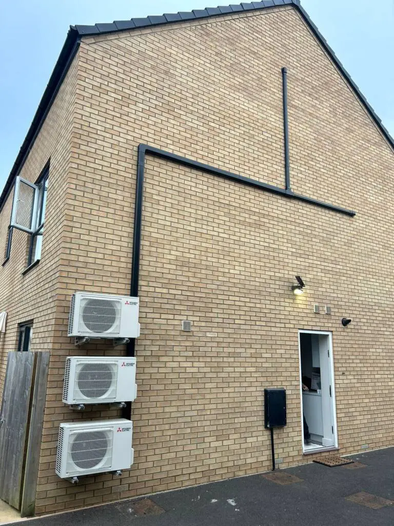 a brick building with air conditioning units
