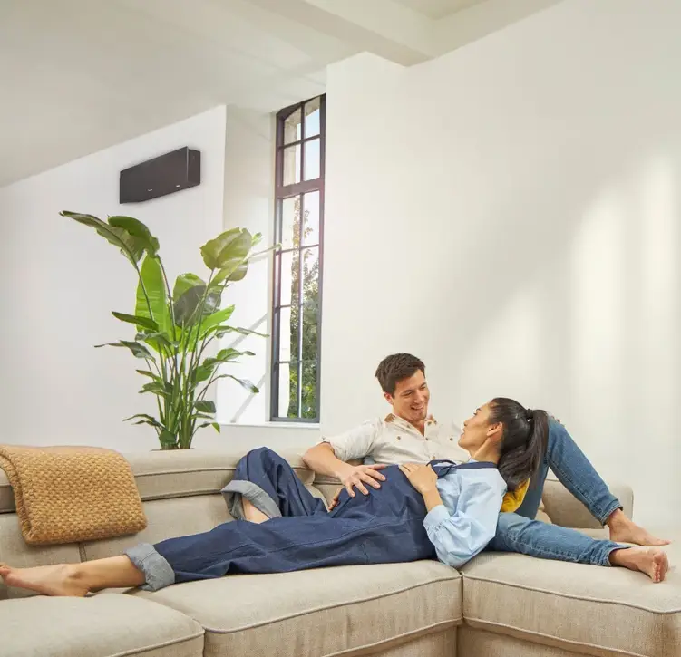 a man and woman lying on a couch